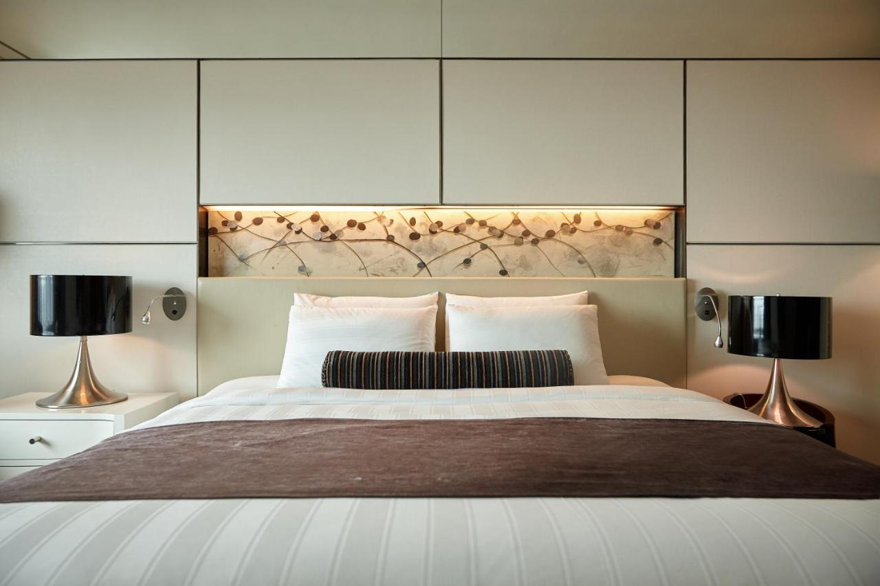 Lotte Hotel Busan Exterior foto A bedroom at the hotel